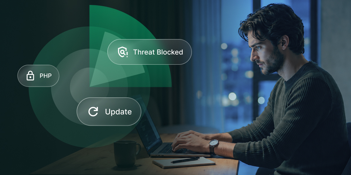 Man working on a laptop with security graphics showing PHP protection, a blocked threat, and a software update.