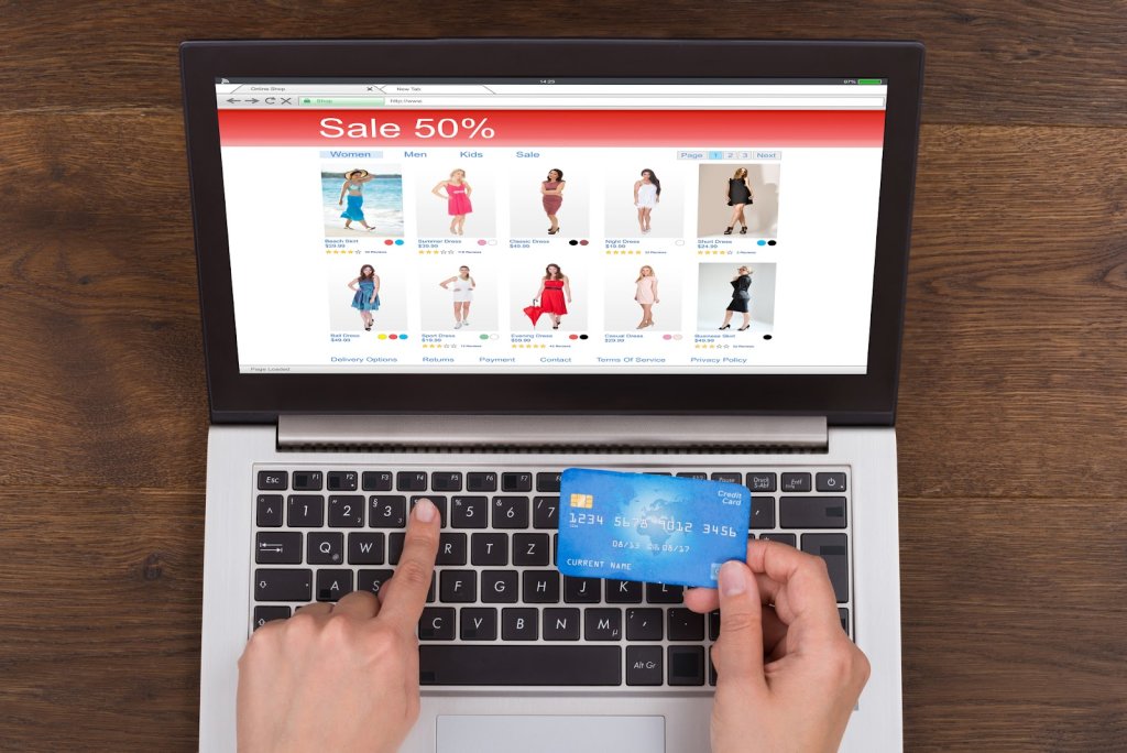 Person Hands Shopping Online With Credit Card And Laptop At Desk